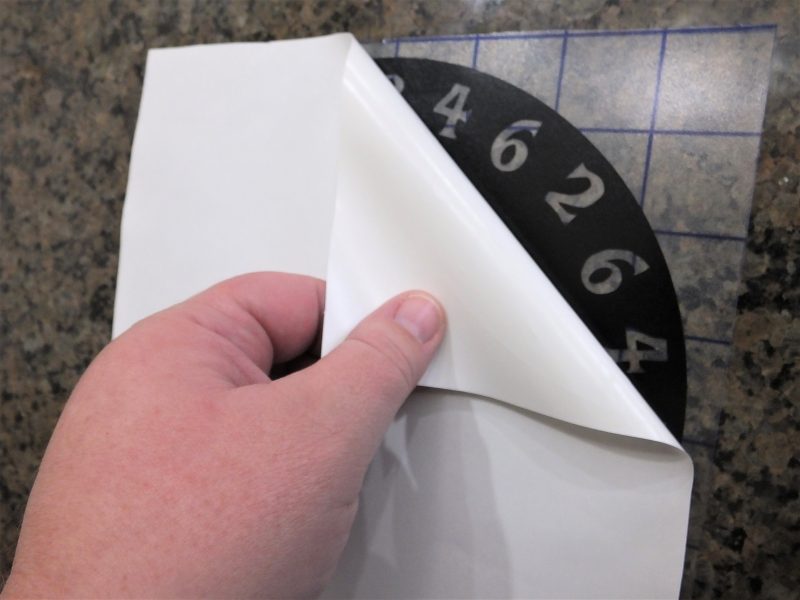 Remove the vinyl backing of the Pi pie plate stencil